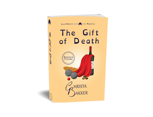 The cover for The Gift of Death by Christa Bakker shows a caped wine bottle surrounded by a baguette, metal balls, and chocolates on a soft orange background